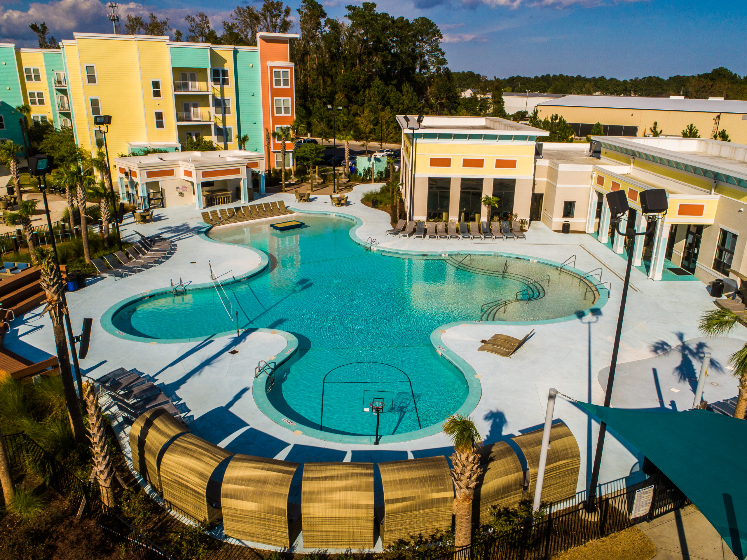Resort-style pool with sundeck at Progress 910, apartments near UNCW